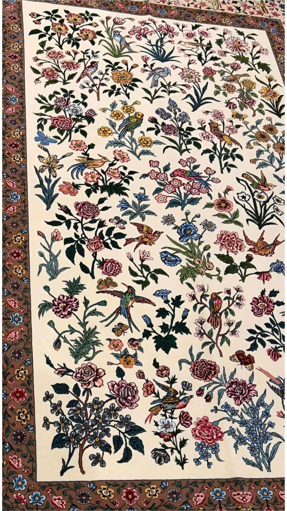 Close-up of wool and silk floral pattern on Seirafian Persian rug